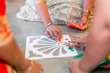 Indian pre wedding haldi ceremony colourful powder mosaic close up