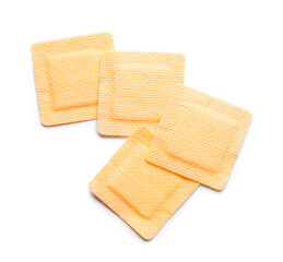 Square medical plasters on white background