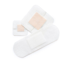 Set of adhesive medical plasters on white background