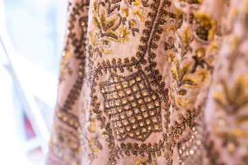Indian bride's wedding dress textile, fabric and pattern close up