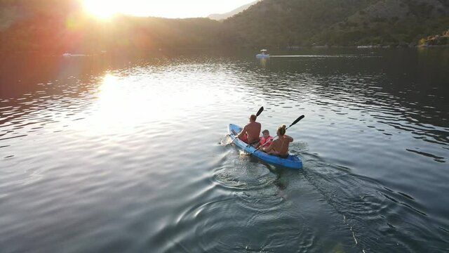 The family is kayaking. Blue color. Active rest. Oludeniz, Blue Lagoon