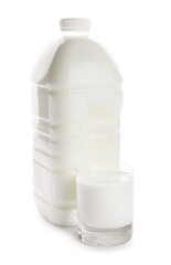 Gallon bottle and glass of milk on white background
