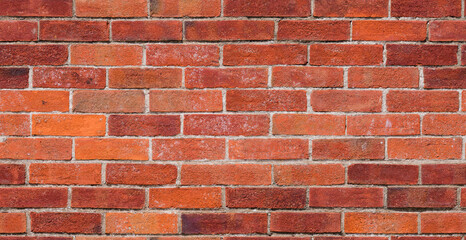 Repeating red brick wall texture typically found in developed areas, often around the back of...