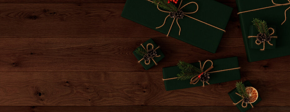 Christmas Presents on a Dark Wood floor, with Homemade decorations.