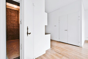 An open white door to another room