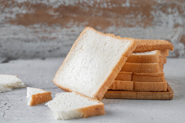 Bread slides on white wooden background