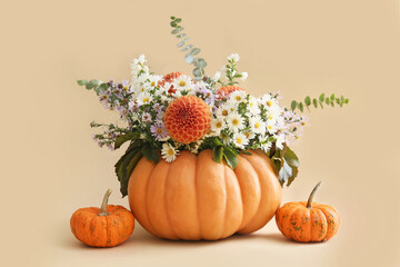 Beautiful autumn bouquet with pumpkins on light background