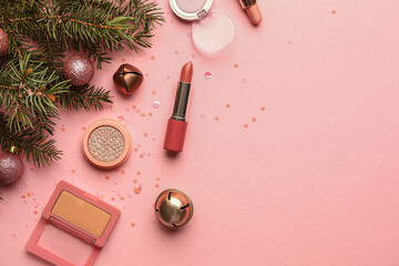 Fir tree branch, Christmas decor and makeup cosmetics on color background