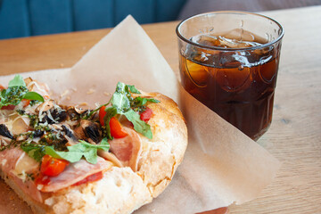 Delicious italian pizza with cola soda with ice
