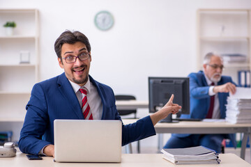 Two male colleagues working in the office