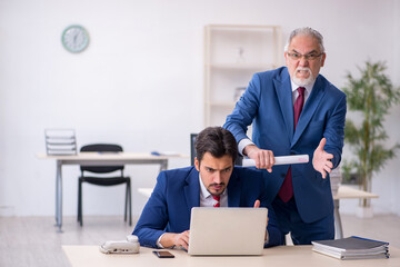 Two male colleagues working in the office