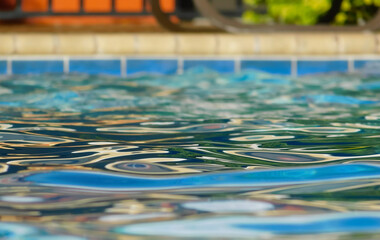 Surface of the pool water in the shadows. 