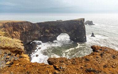 Famous Dyrholaey, basalt rock formations landscape in southern Iceland