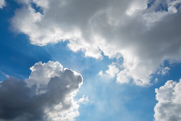 Naklejka na ściany i meble Beautiful clouds, sun ray over the sky