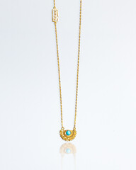 gold necklace with a pendant