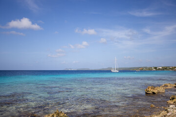 Fototapeta na wymiar Deserted beach with turquoise colour sea. Beautiful seascape.