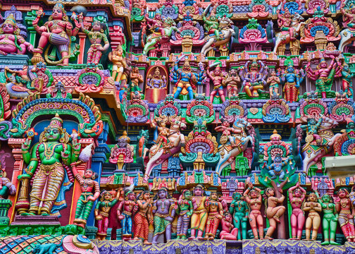 Colorful idols on the Gopuram, Sarangapani Temple. One of the ancient temples in the south of India. Tamil Nadu, India.