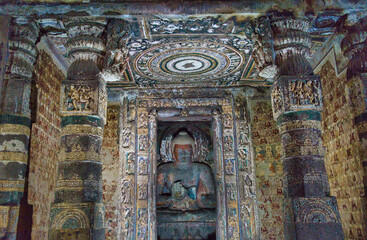 The paintings and sculptures considered masterpieces of Buddhist religious art. The Buddhist Caves in Ajanta are approximately 30 rock-cut Buddhist cave. Maharashtra, India.