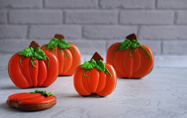 gingerbread hand-painted in the form of pumpkins on a light background