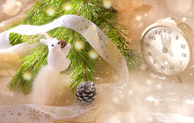 Holiday Christmas still life, pine branches with toys and old vintage  alarm clock