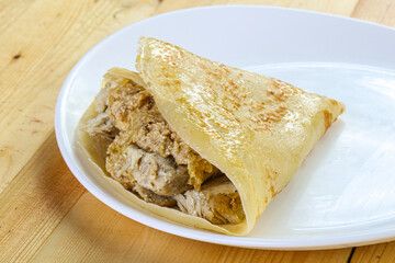 Pancake with chicken and onion