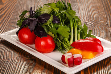 Fresh vegetables plate with vegetables and herbs
