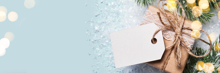 Gift box packed in paper with lace and twine. Eco Christmas decor, banner format