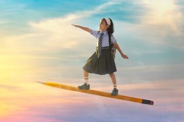 portrait of a girl in school uniform flying on pencil in the sky
