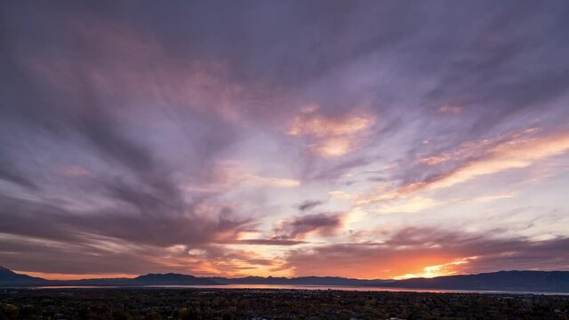 Colorful timelapse over Orem and Provo in Utah Valley at sunset in the Autumn looking towards Utah Lake.