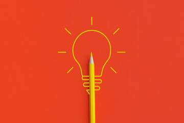 Light bulb on red background. Inspiration and creative idea concept. Top view with copy space. Flat lay composition.
