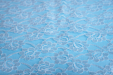 Blue fabric background. Lace background. Selective focus. A place to copy