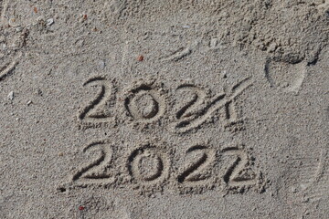 Two thousand twenty two written on sand