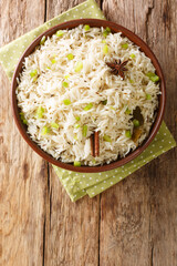 Jeera rice or Zeera rice is an Indian dish consisting of rice and cumin seeds close up in the bowl...