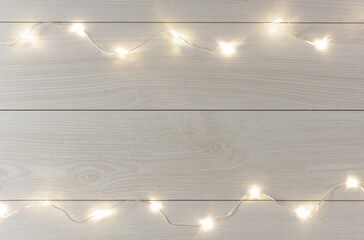 background material of white wood board and illumination. 白い木製の板とイルミネーションの背景素材	