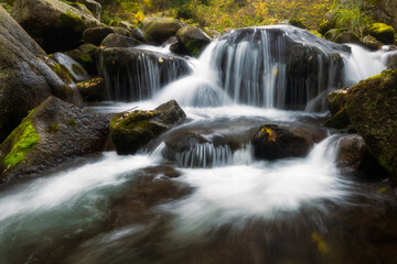 Fototapeta na wymiar Beautiful waterfall on a mountain river