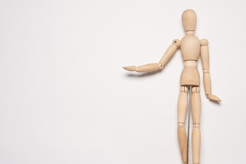 wooden man mannequin posing object light background