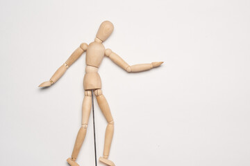 wooden mannequin object close up light background
