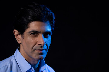 Portrait of a middle age man with black background
