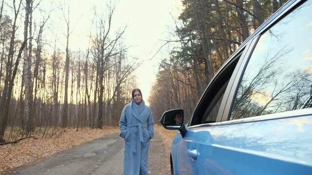 Car Driver Throws Empty Plastic Coffee Cup Away From Open Window And Woman Walking Along Road Near Forest Returns Trash Back To Man Into Auto