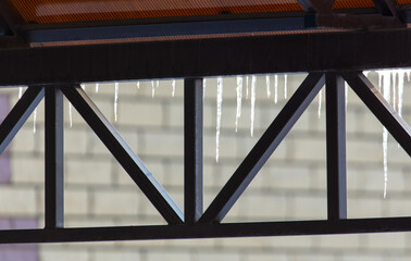 Icicles hang from the roof