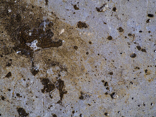 Textured concrete background with many potholes, scratches, irregularities, scuffs with colored...