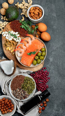 Assortment of omega 3 best sources on dark background.