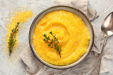 Corn polenta on gray background.