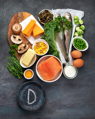 Foods high in vitamin D on dark background. - obrazy, fototapety, plakaty