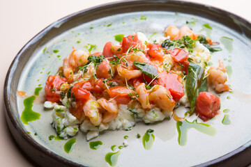 Egg and shrimp omelet served with tomatoes