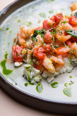 Egg and shrimp omelet served with tomatoes
