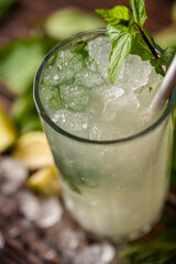 Luxury cocktail with lemon and tequila on a dark stone background