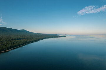 Fototapeta na wymiar Summertime imagery of Lake Baikal in morning is a rift lake located in southern Siberia, Russia. Baikal lake summer landscape view. Drone's Eye View.