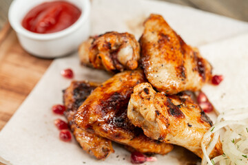 chicken wings grill. Serving on a white plate on a table. Barbecue restaurant menu, a series of photos of different meats