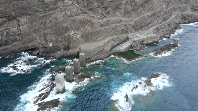 Aerial view of sea waves hitting rocks in the natural pools of Hermigua on the coast of La Gomera